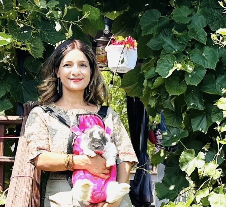 Huma Asif holding a rabbit