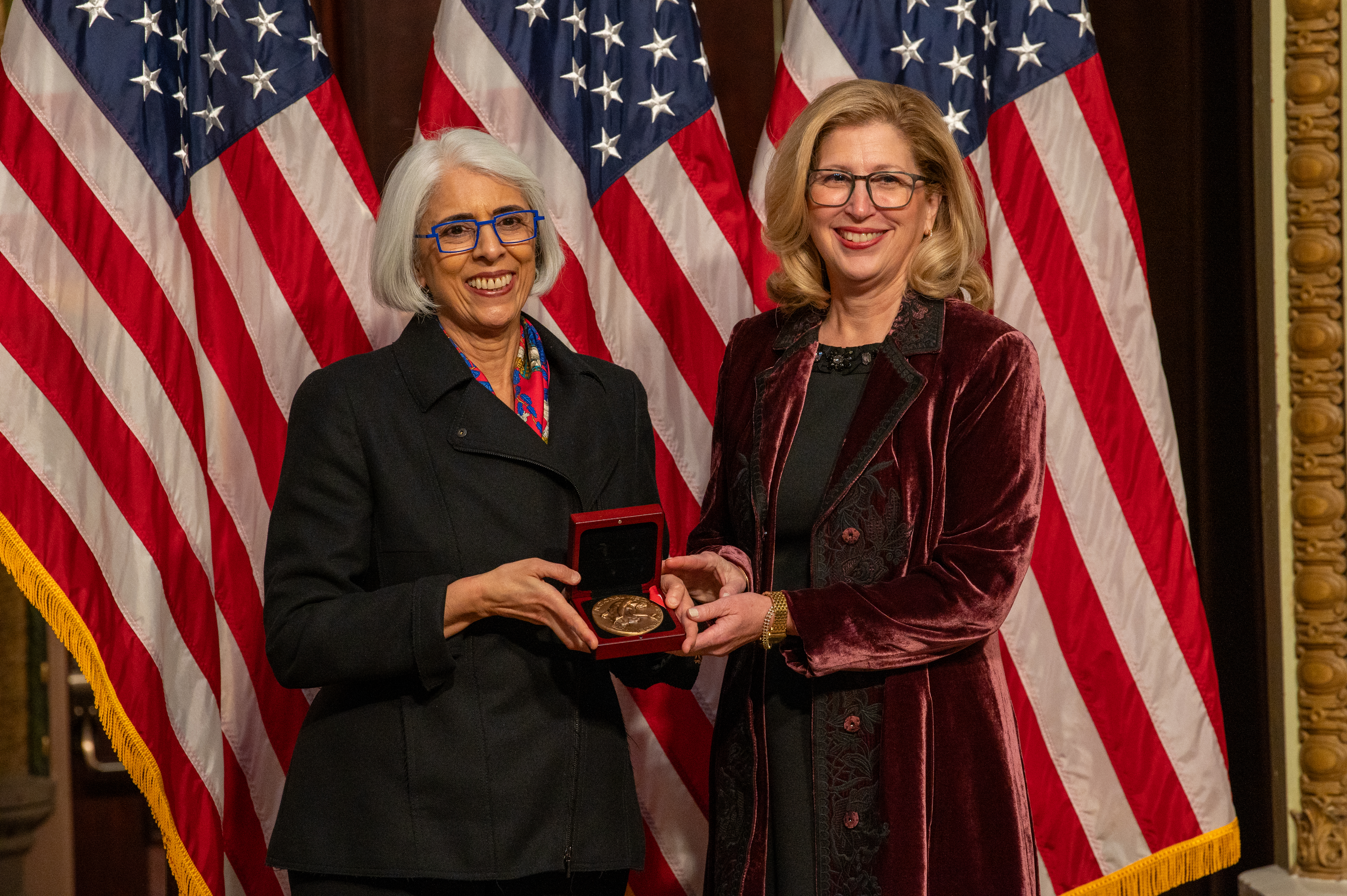 Arati Prabhakar, Director of the White House Office of Science and Technology Policy, presents award to Teresa Woodruff 